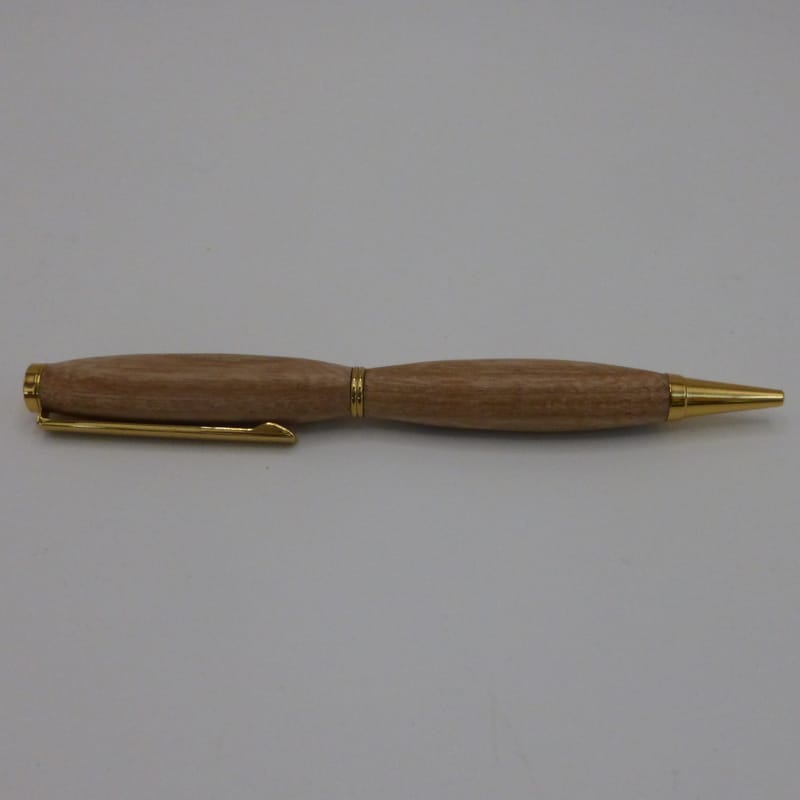 Style bille de la collection Inspiration avec une forme classique arrondie en bois de chêne avec un mécanisme plaqué or